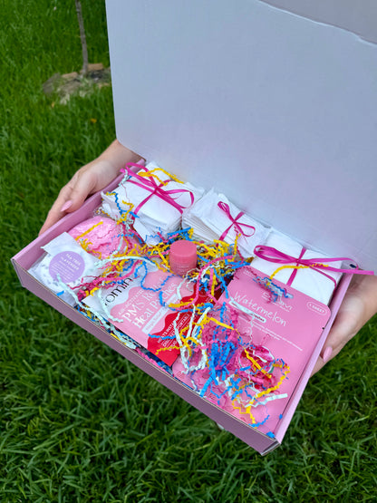 Contents of the FlowState period and self-care box, including pads, tampons, and self-care items